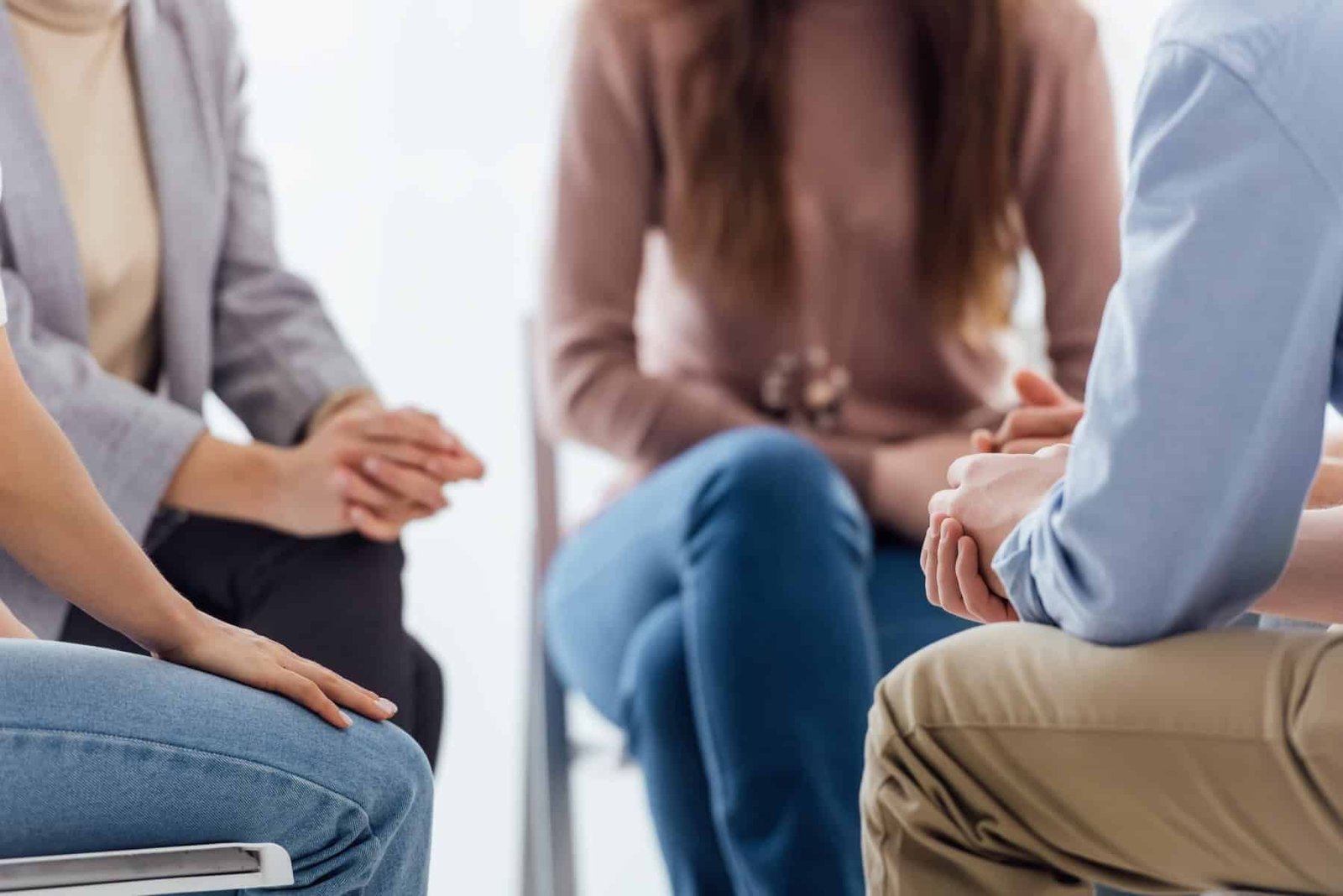 treatment professional hosts group therapy session for mental health